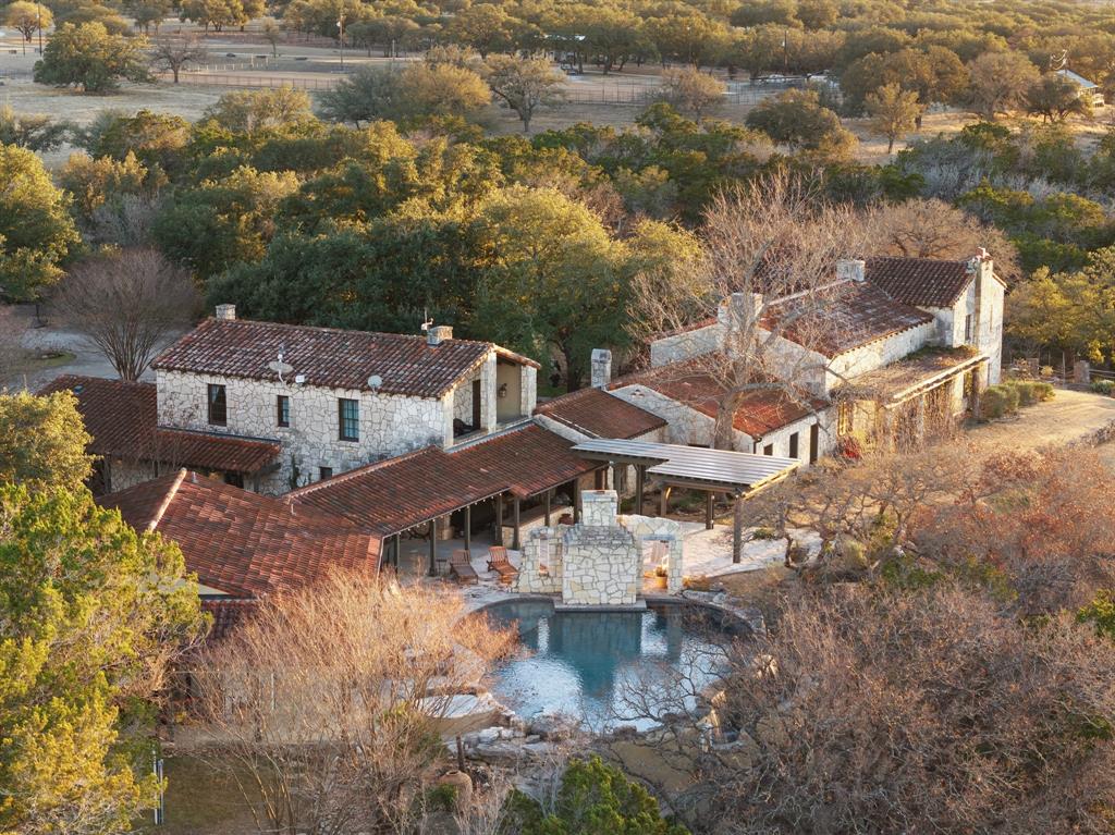 154 Mr Bar Par Hunt, TX 78024 - Photo 2 of 40 an aerial view of residential houses with outdoor space and trees