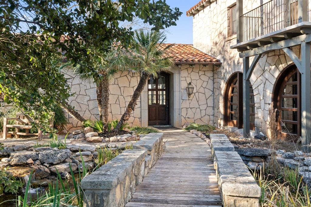 154 Mr Bar Par Hunt, TX 78024 - Photo 8 of 40 a view of a pathway with a fountain and a fire pit