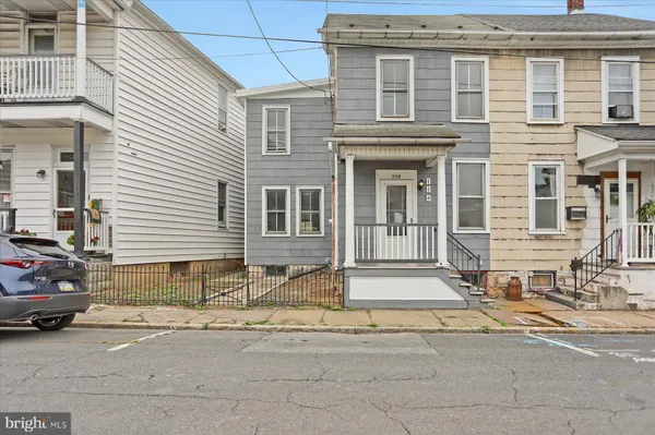 a front view of a house with a outdoor space