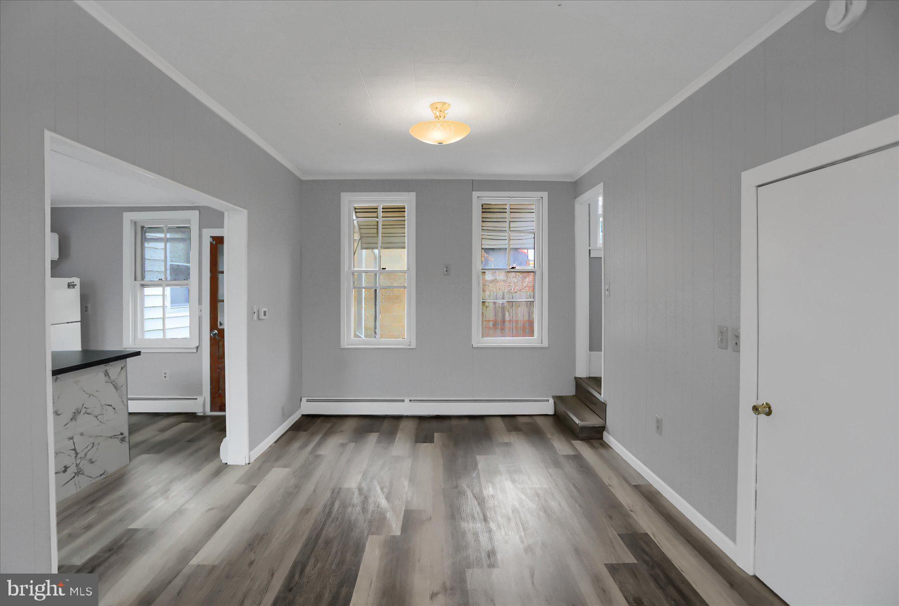 114 South 5th Street Shamokin, PA 17872 - Photo 6 of 25 wooden floor in an empty room with a window