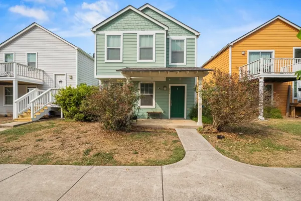 front view of a house with a yard