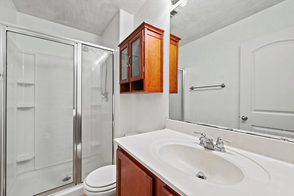 246 Trestle Tree San Marcos, TX 78666 - Photo 11 of 14 a bathroom with a sink toilet and shower