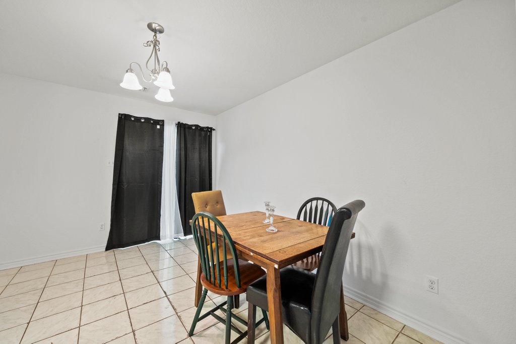 246 Trestle Tree San Marcos, TX 78666 - Photo 4 of 14 a view of a dining room with furniture and chandelier