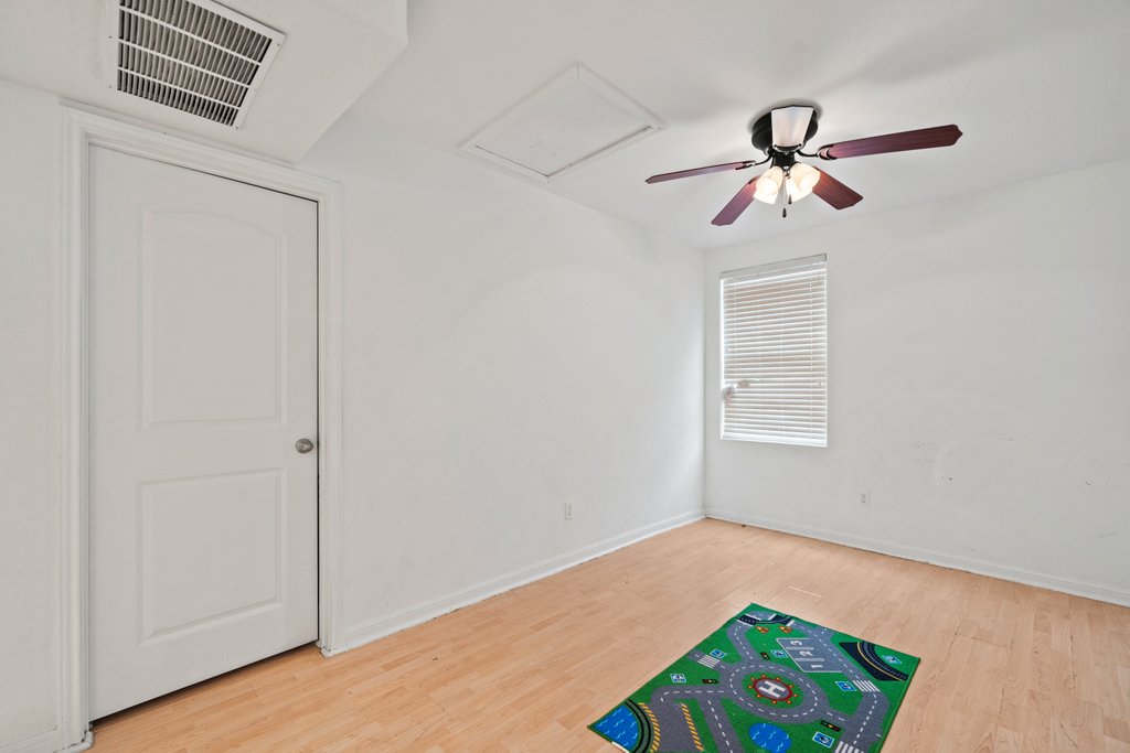 246 Trestle Tree San Marcos, TX 78666 - Photo 8 of 14 a view of room with a ceiling fan and wooden floor