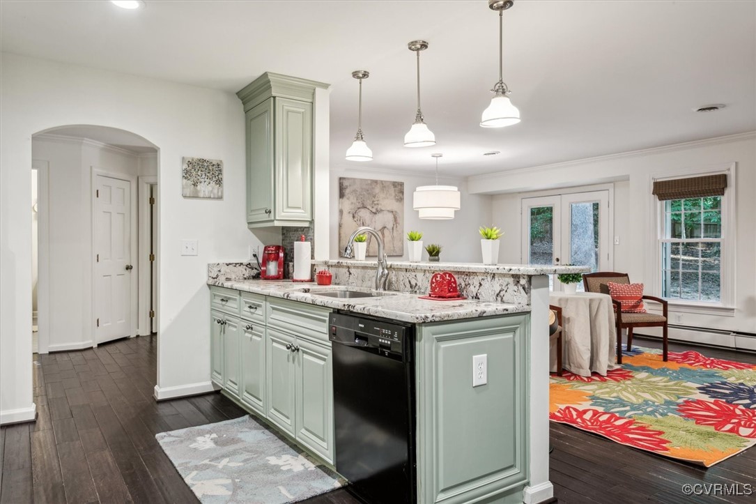 4704 Lady Slipper Path Williamsburg, VA 23188 - Photo 16 of 50 a kitchen with kitchen island a sink stove and wooden floor