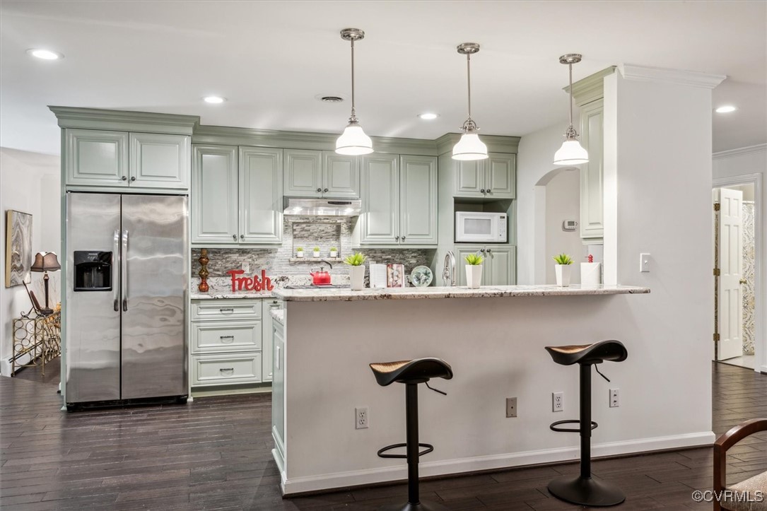 4704 Lady Slipper Path Williamsburg, VA 23188 - Photo 17 of 50 a kitchen with stainless steel appliances granite countertop a refrigerator a sink and a stove