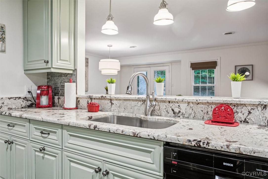 4704 Lady Slipper Path Williamsburg, VA 23188 - Photo 18 of 50 a kitchen with granite countertop stainless steel appliances sink and cabinets