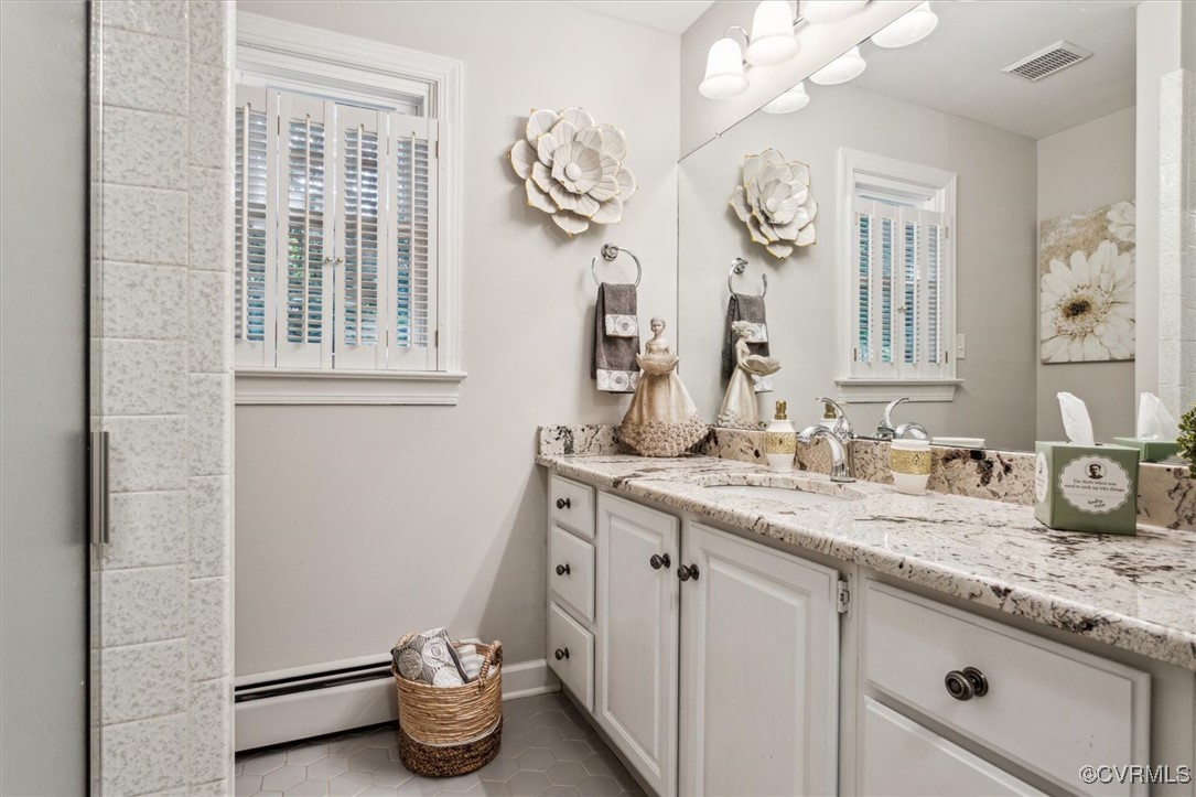 4704 Lady Slipper Path Williamsburg, VA 23188 - Photo 34 of 50 a bathroom with a granite countertop sink a toilet and a mirror