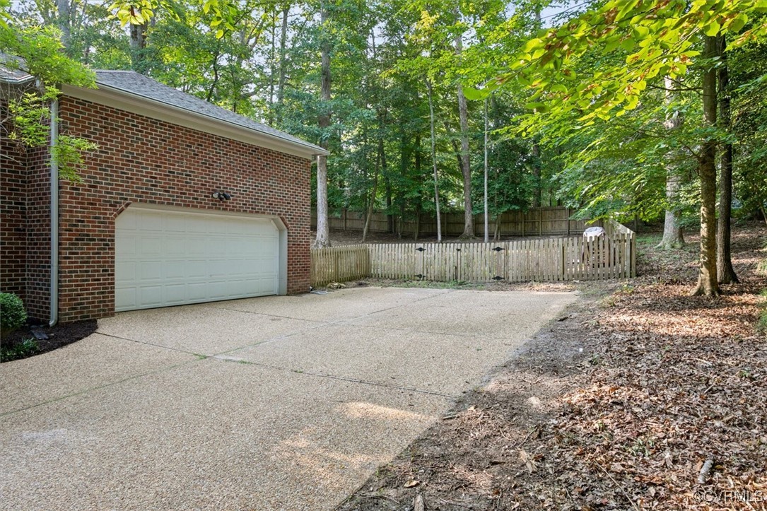 4704 Lady Slipper Path Williamsburg, VA 23188 - Photo 42 of 50 a view of backyard and tree