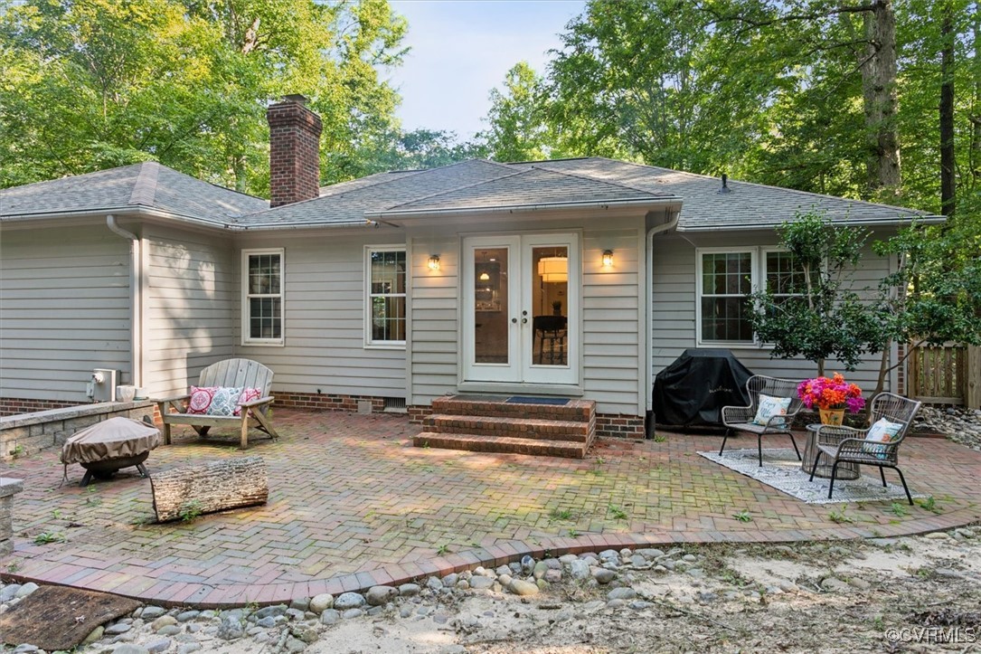 4704 Lady Slipper Path Williamsburg, VA 23188 - Photo 46 of 50 a view of a house with a patio and a yard