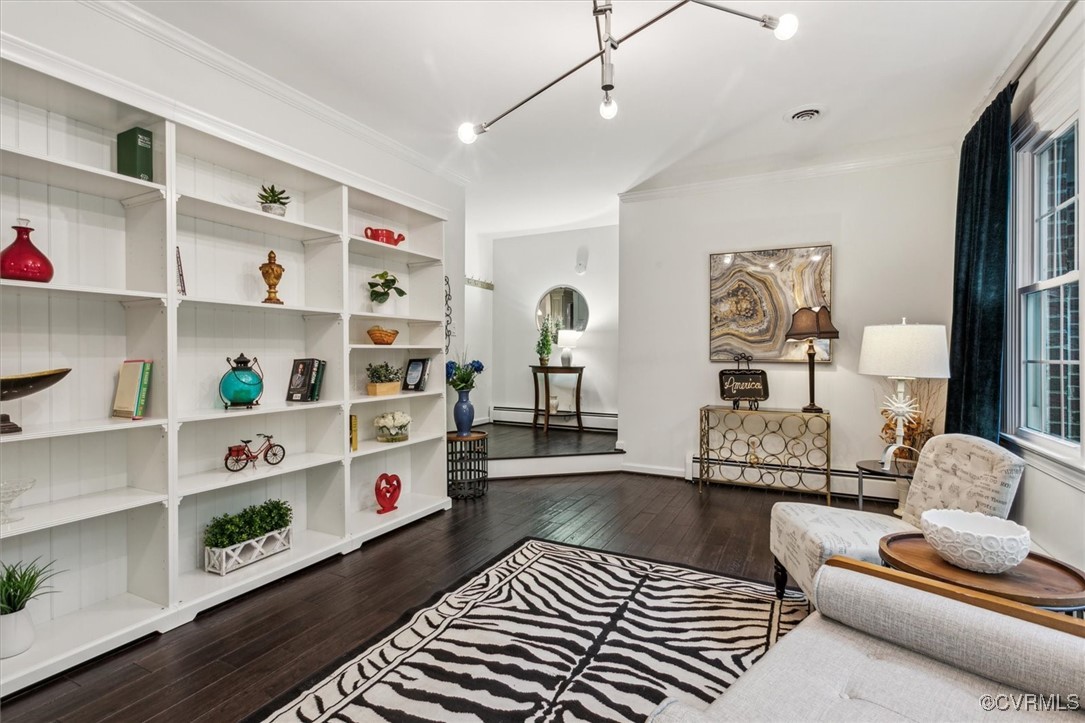 4704 Lady Slipper Path Williamsburg, VA 23188 - Photo 7 of 50 a living room with furniture and a book shelf