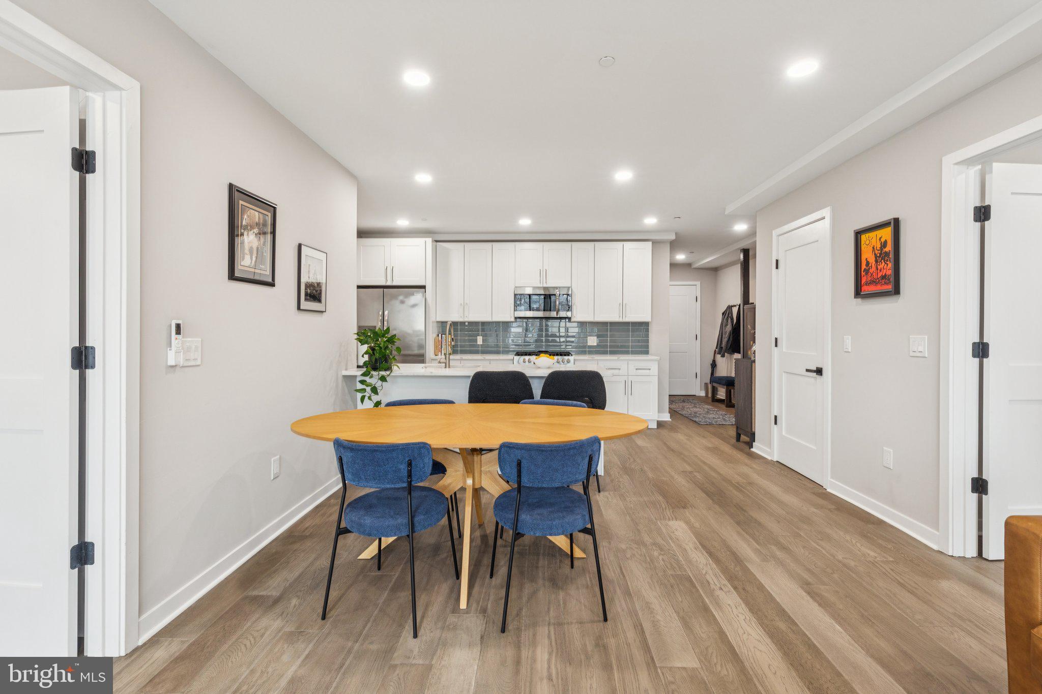 1648-50 Ridge Avenue, Unit 301 Philadelphia, PA 19130 - Photo 12 of 37 a view of a dining room with furniture and wooden floor