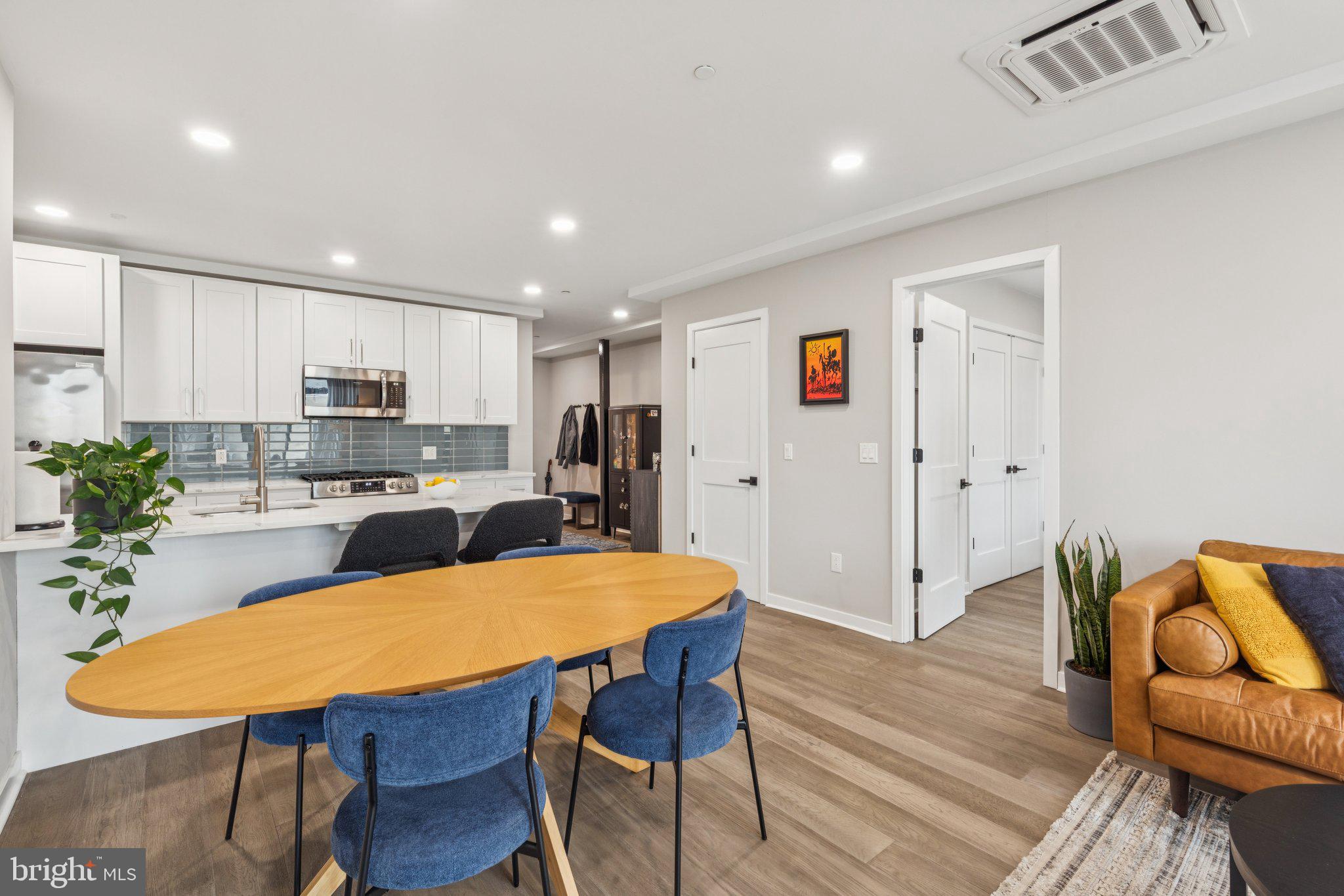 1648-50 Ridge Avenue, Unit 301 Philadelphia, PA 19130 - Photo 13 of 37 a view of a dining room with furniture and wooden floor