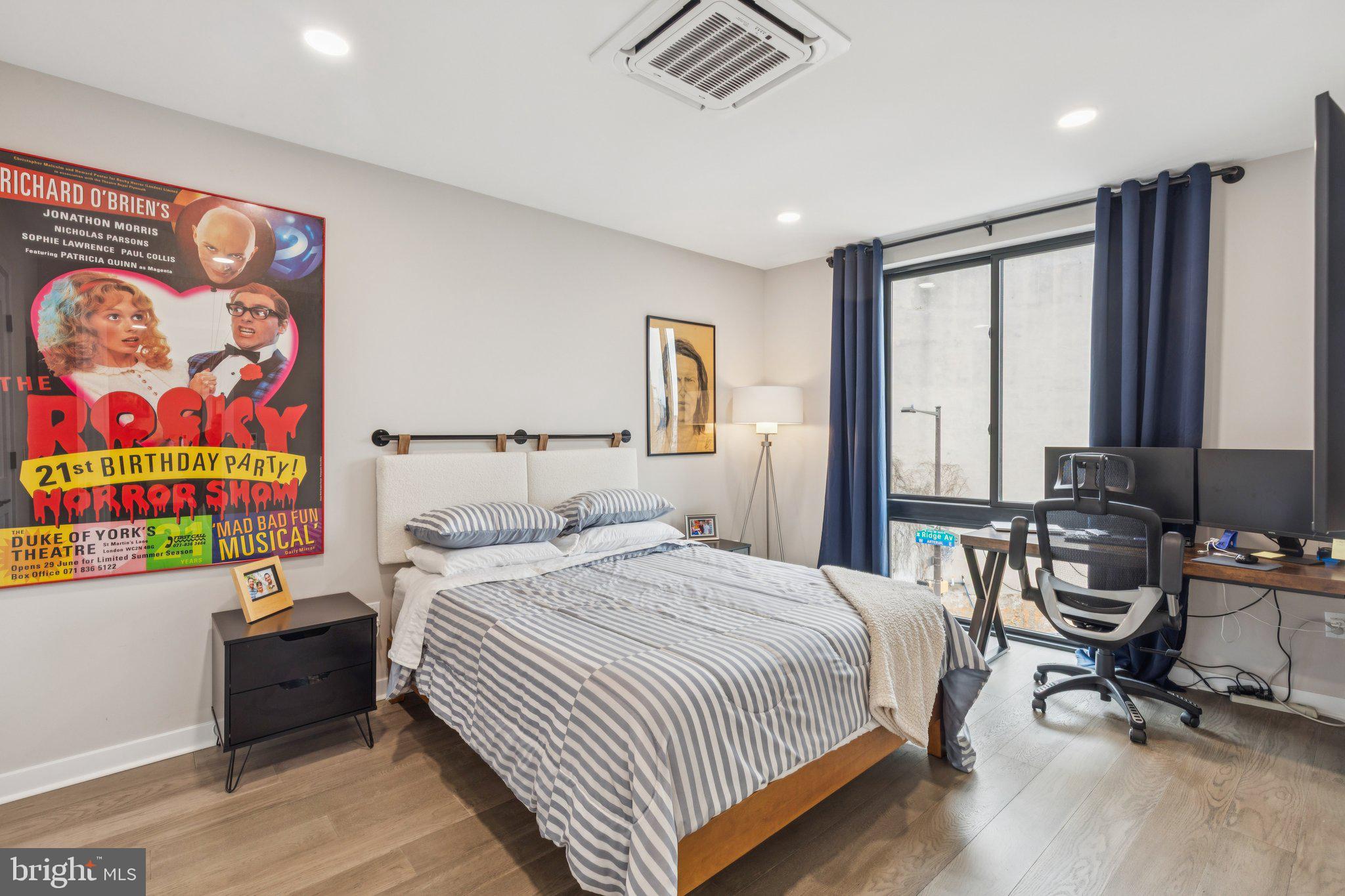 1648-50 Ridge Avenue, Unit 301 Philadelphia, PA 19130 - Photo 19 of 37 a bedroom with a bed and a desk