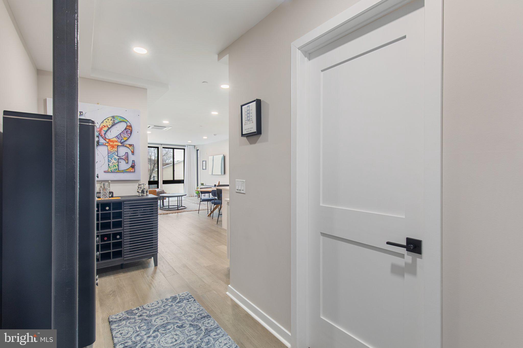 1648-50 Ridge Avenue, Unit 301 Philadelphia, PA 19130 - Photo 2 of 37 a view of a hallway and a livingroom with furniture
