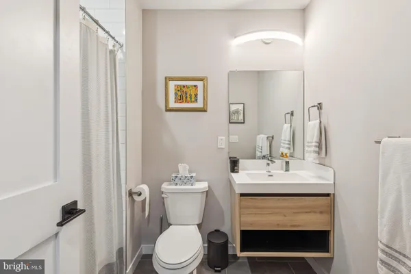 a bathroom with a shower and a toilet