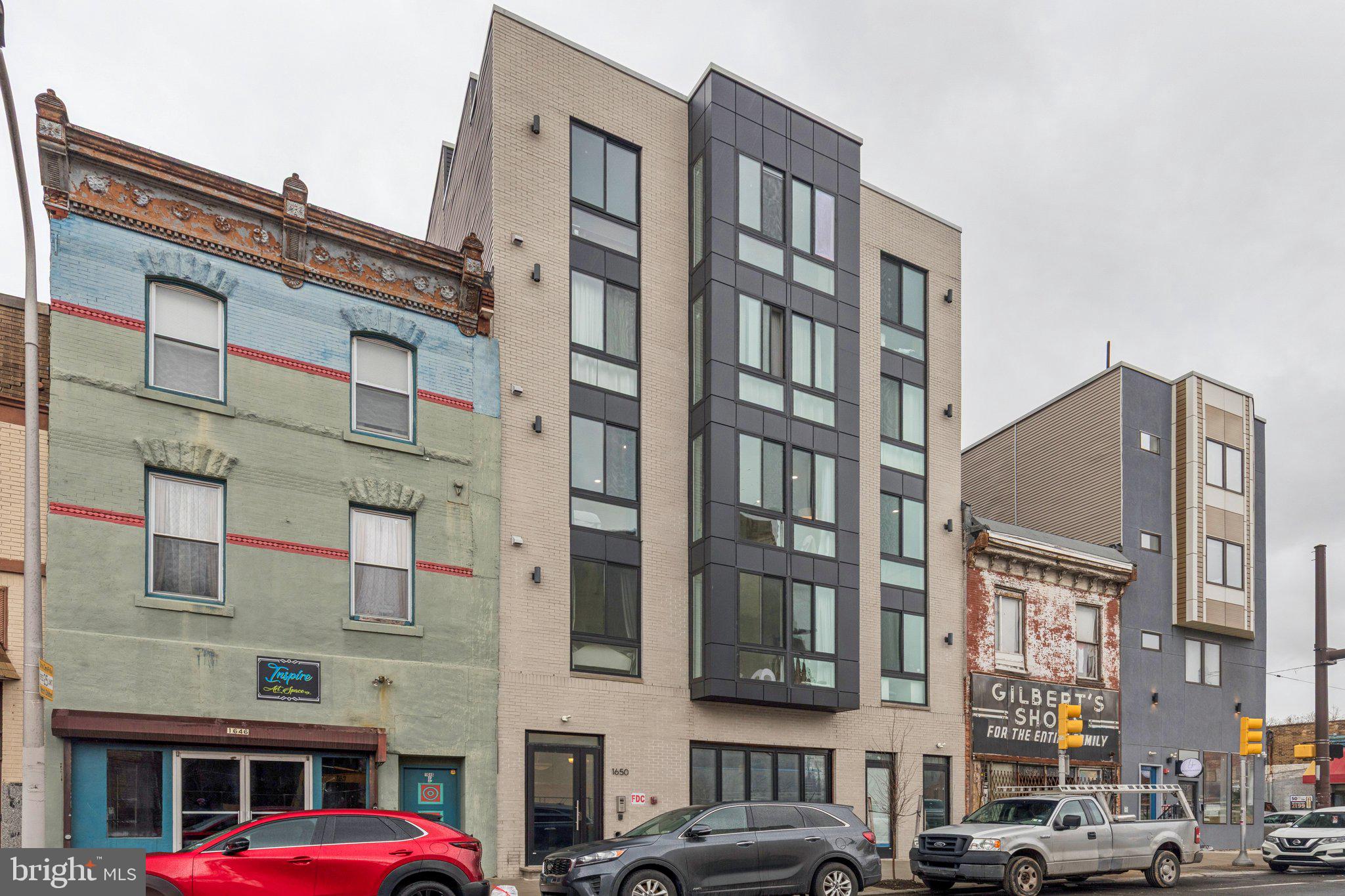 1648-50 Ridge Avenue, Unit 301 Philadelphia, PA 19130 - Photo 34 of 37 a front view of a building with lot of windows