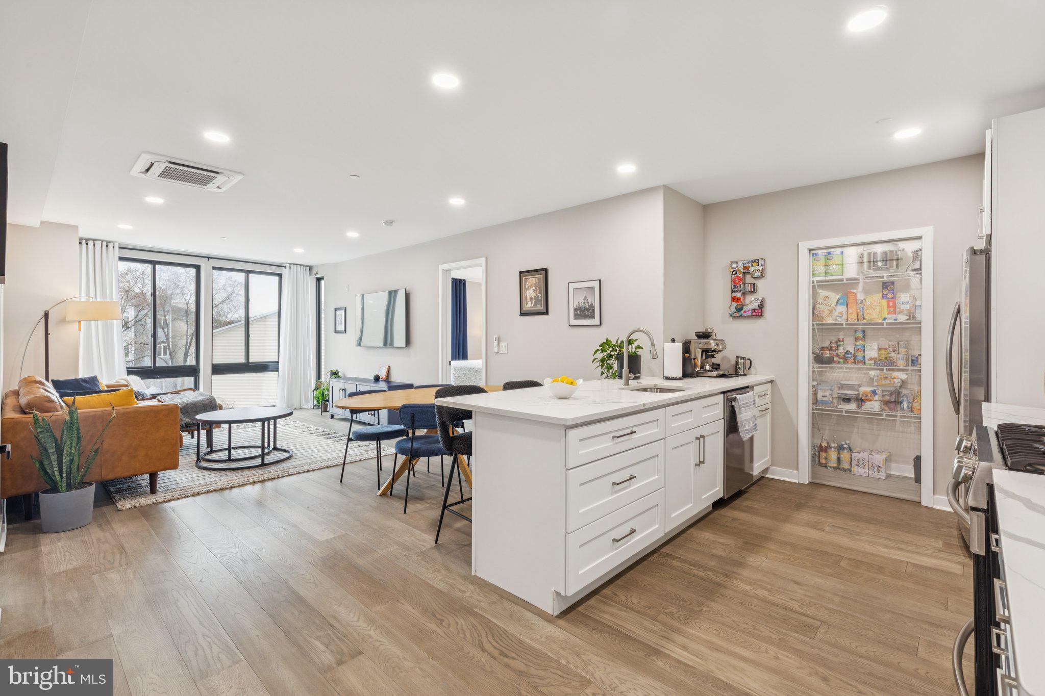 1648-50 Ridge Avenue, Unit 301 Philadelphia, PA 19130 - Photo 5 of 37 a room with furniture and a wooden floor