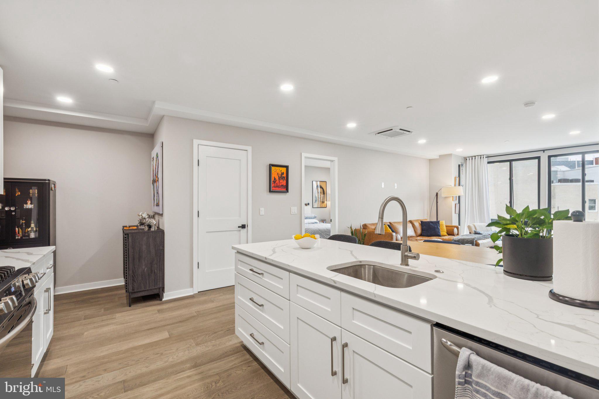 1648-50 Ridge Avenue, Unit 301 Philadelphia, PA 19130 - Photo 10 of 37 a kitchen with sink and refrigerator