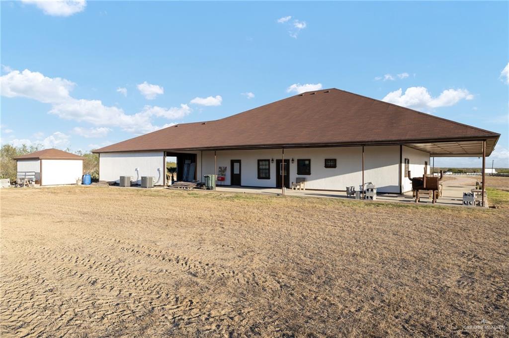 2991 North Us Highway Roma, TX 78584 - Photo 21 of 28 Rear view of property featuring a patio area