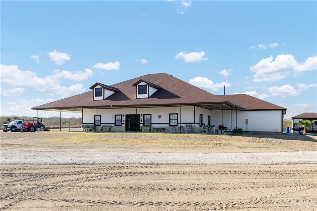 2991 North Us Highway Roma, TX 78584 - Photo 3 of 28 View of front of home with a porch and a carport