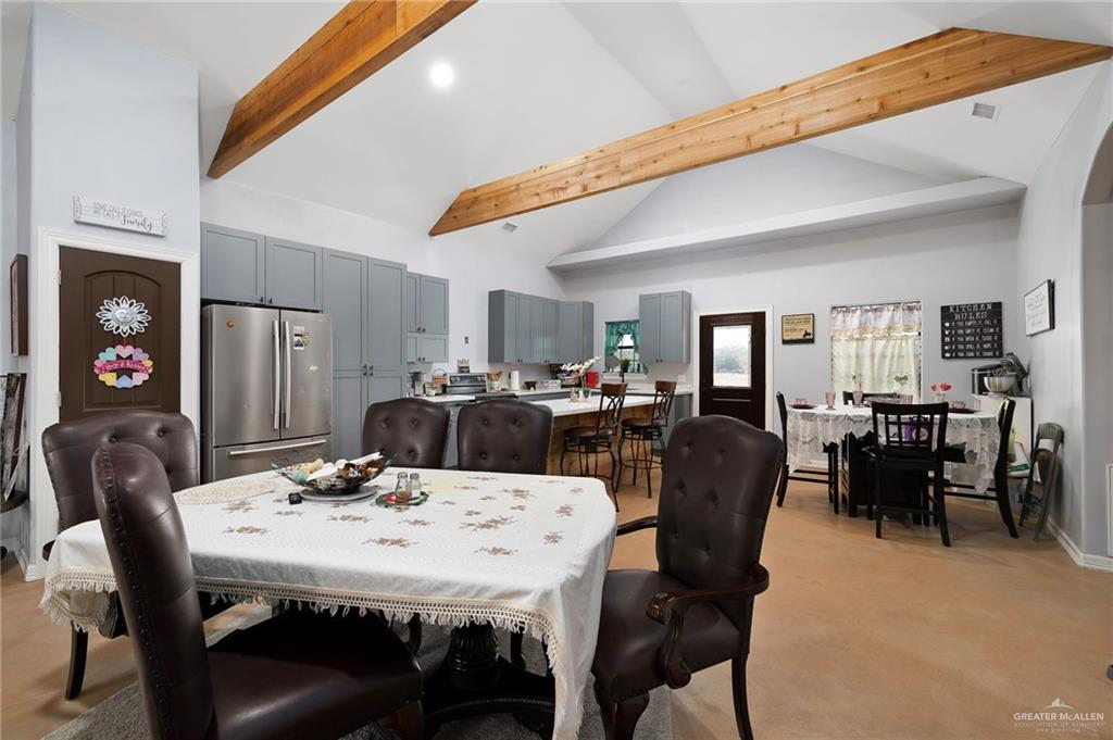 2991 North Us Highway Roma, TX 78584 - Photo 8 of 28 Dining room with high vaulted ceiling, beamed ceiling, and recessed lighting