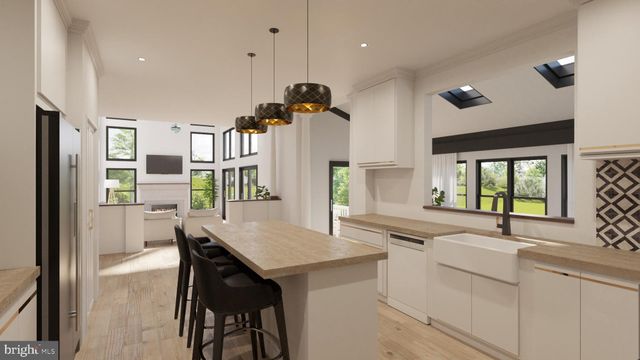 a kitchen with a table chairs refrigerator and cabinets