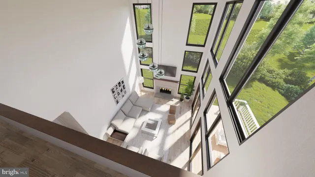 a view of living room with furniture and a mirror