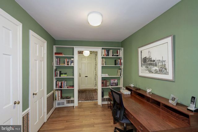 a room with furniture and a bookshelf
