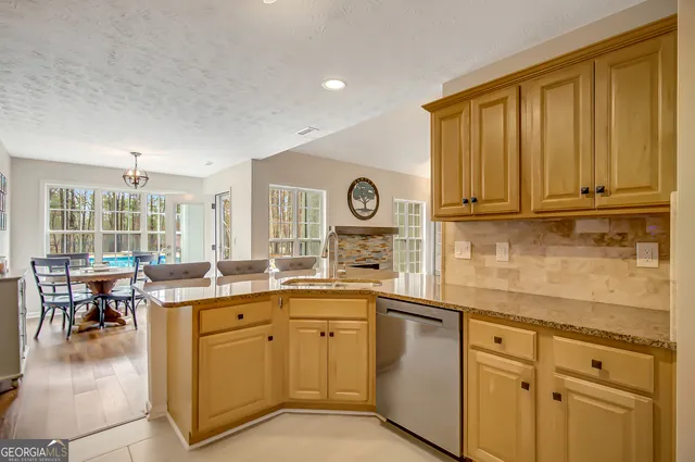 a kitchen with cabinets and outdoor view