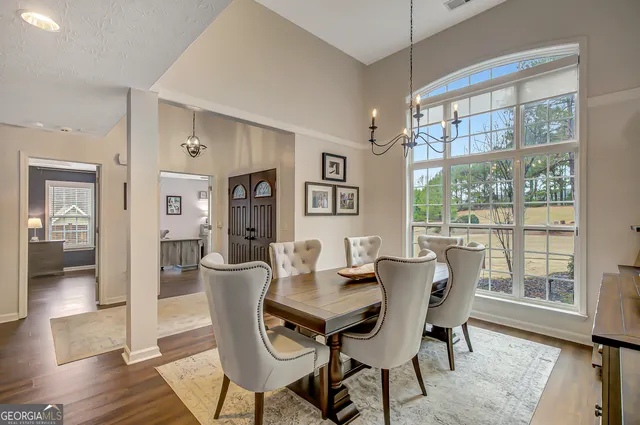 a view of a dining room with furniture window and wooden floor