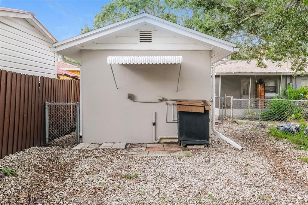 Undisclosed Address Clearwater, FL 33755 - Photo 14 of 15 a front view of a house with a yard
