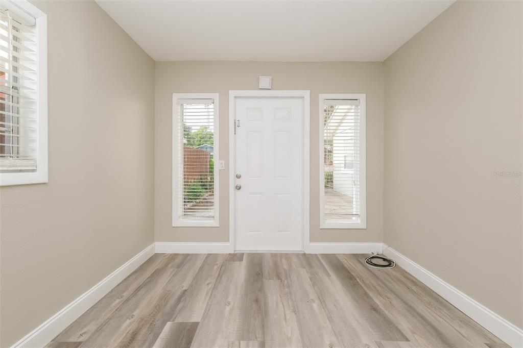 Undisclosed Address Clearwater, FL 33755 - Photo 3 of 15 an empty room with windows