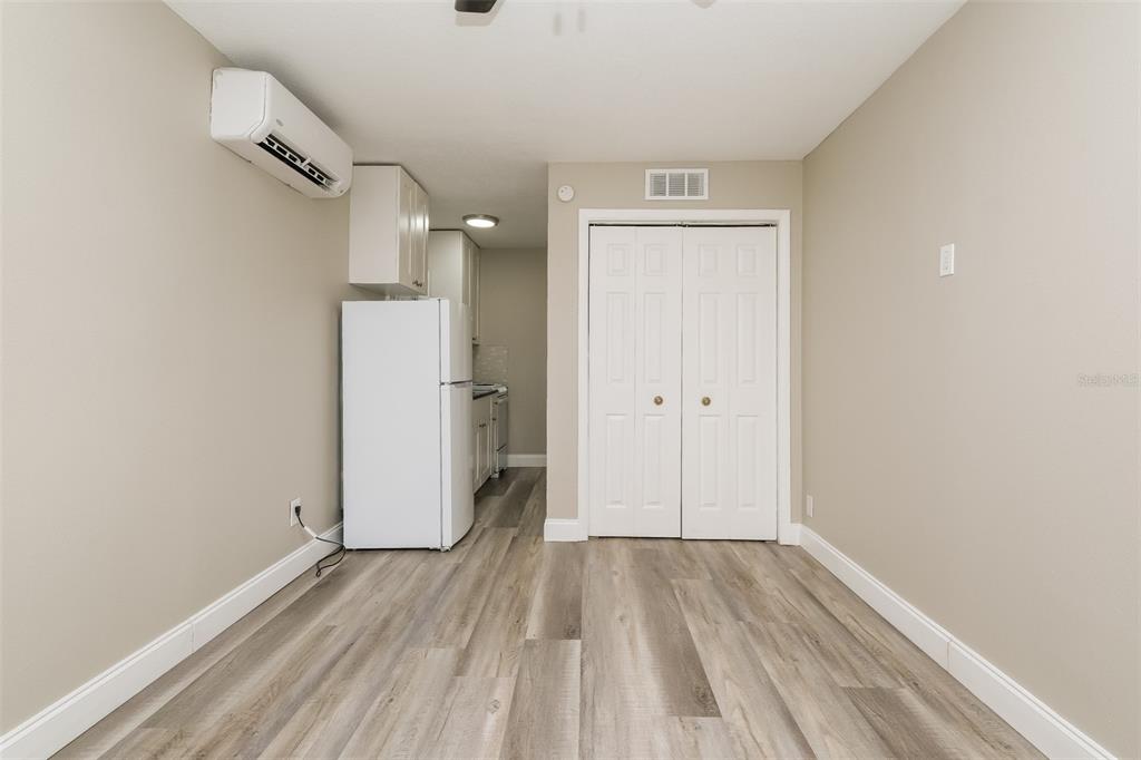 Undisclosed Address Clearwater, FL 33755 - Photo 4 of 15 a view of a room with wooden floor and a bathroom
