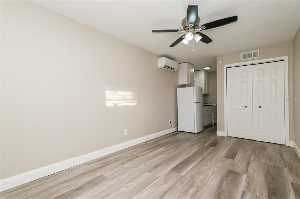 Undisclosed Address Clearwater, FL 33755 - Photo 7 of 15 a view of empty room with wooden floor and ceiling fan