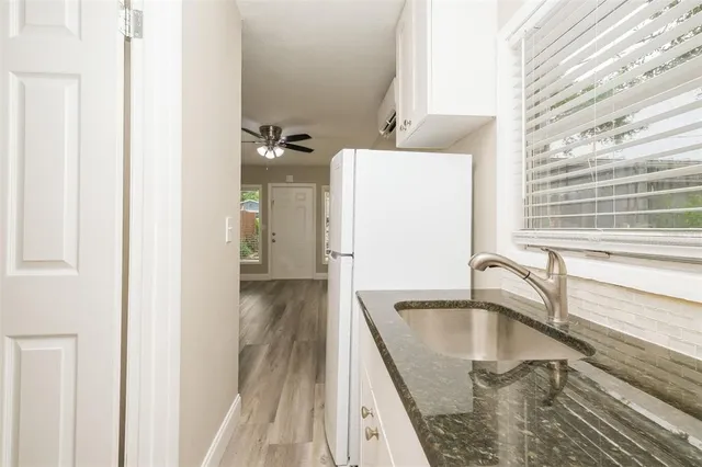 a white toilet sitting next to a shower curtain