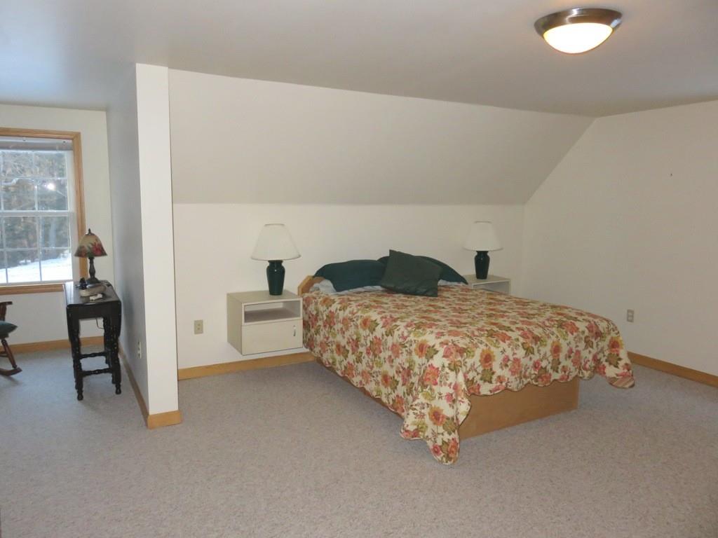 124 Werden Road Otis, MA 01253 - Photo 12 of 14 a bedroom with a bed and a table