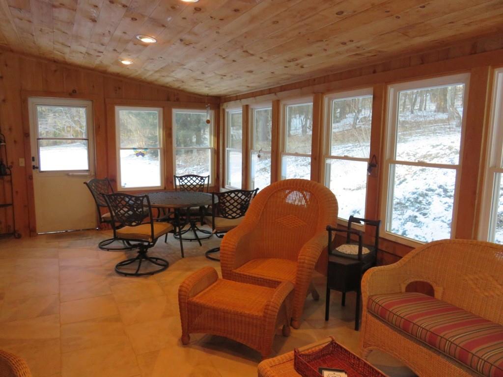 124 Werden Road Otis, MA 01253 - Photo 7 of 14 a living room with furniture and floor to ceiling windows