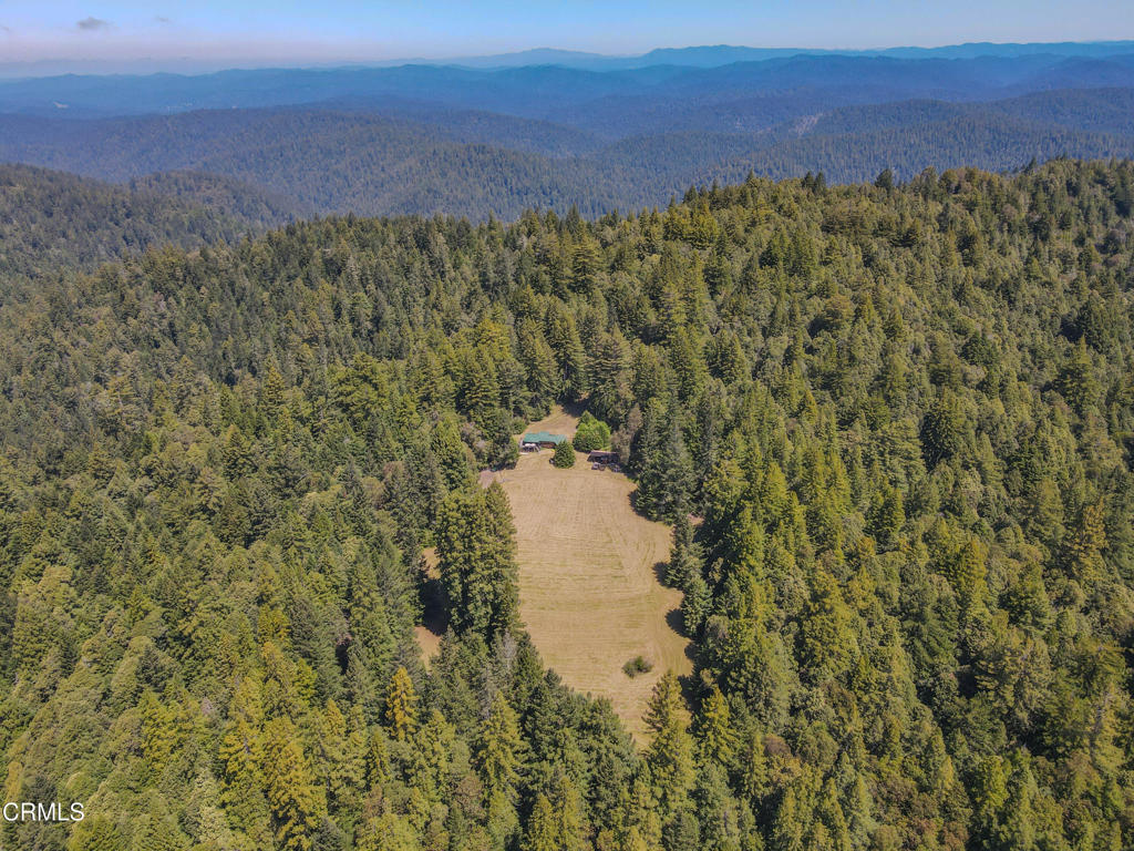 28680 Comptche Ukiah Road Comptche, CA 95427 - Photo 2 of 58 a view of a lake and green valley