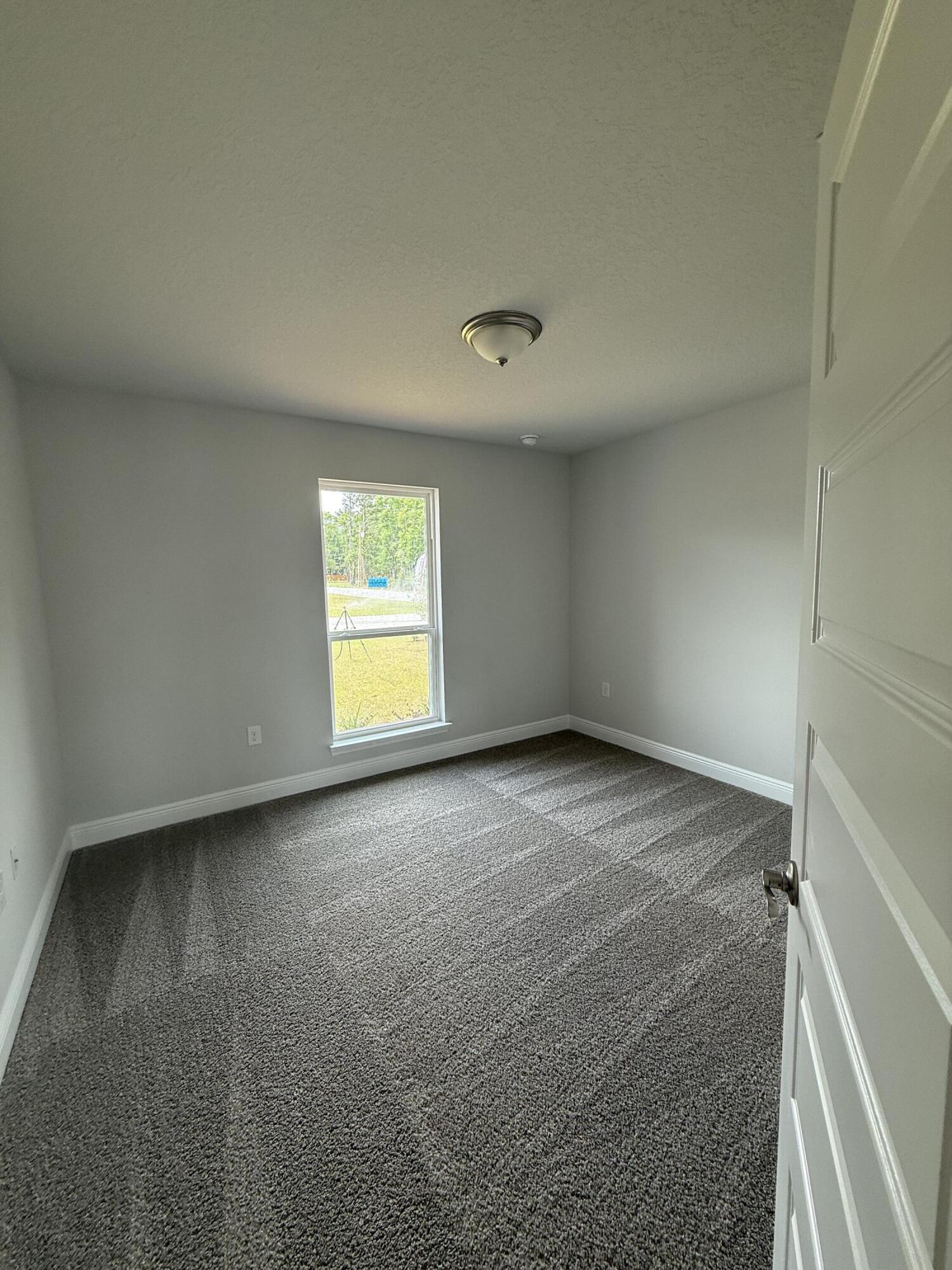 6000 Crocket Cove Crestview, FL 32539 - Photo 9 of 20 a view of an empty room with a window