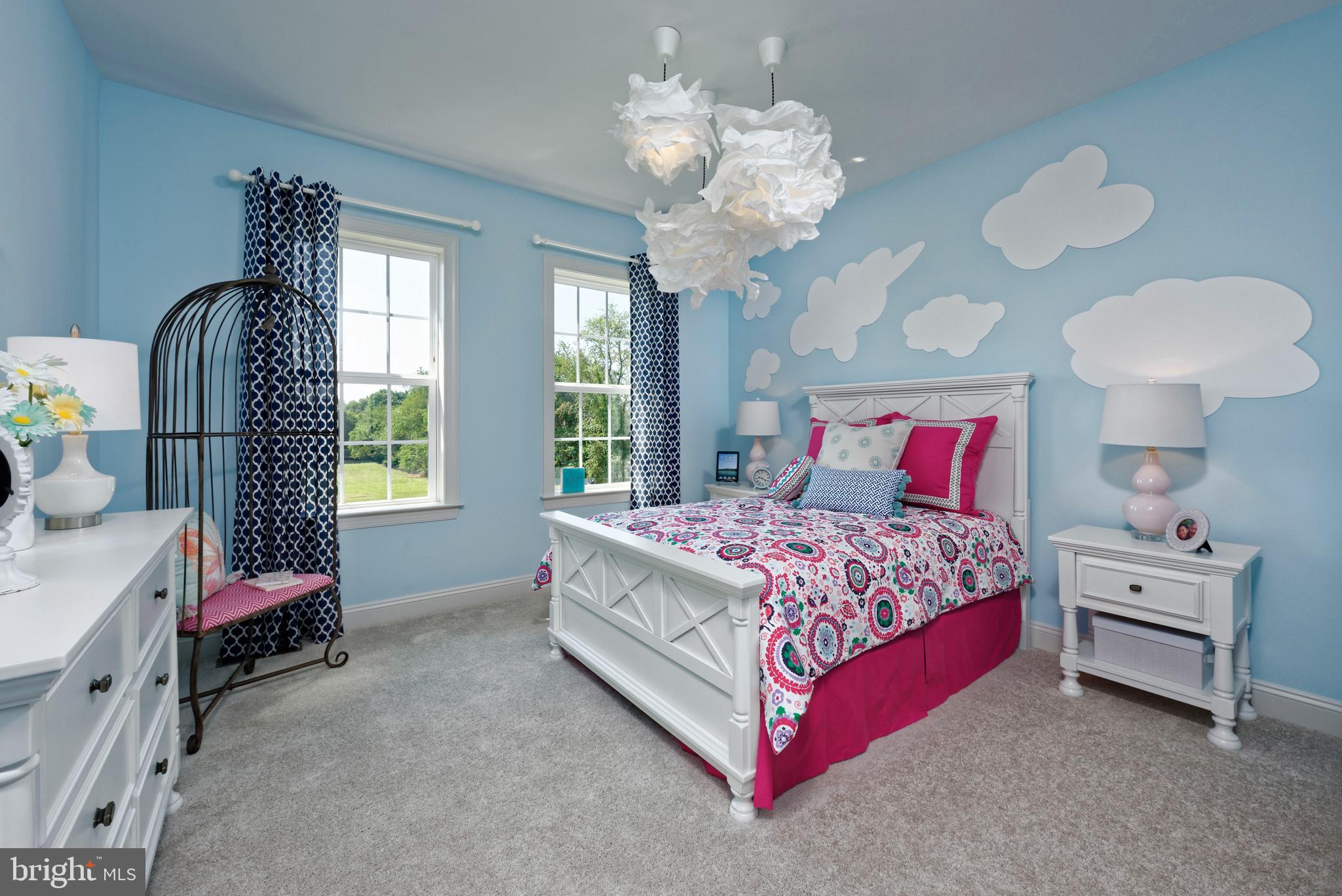 13044 Highland Road Highland, MD 20777 - Photo 6 of 11 a bedroom with a bed and a chandelier