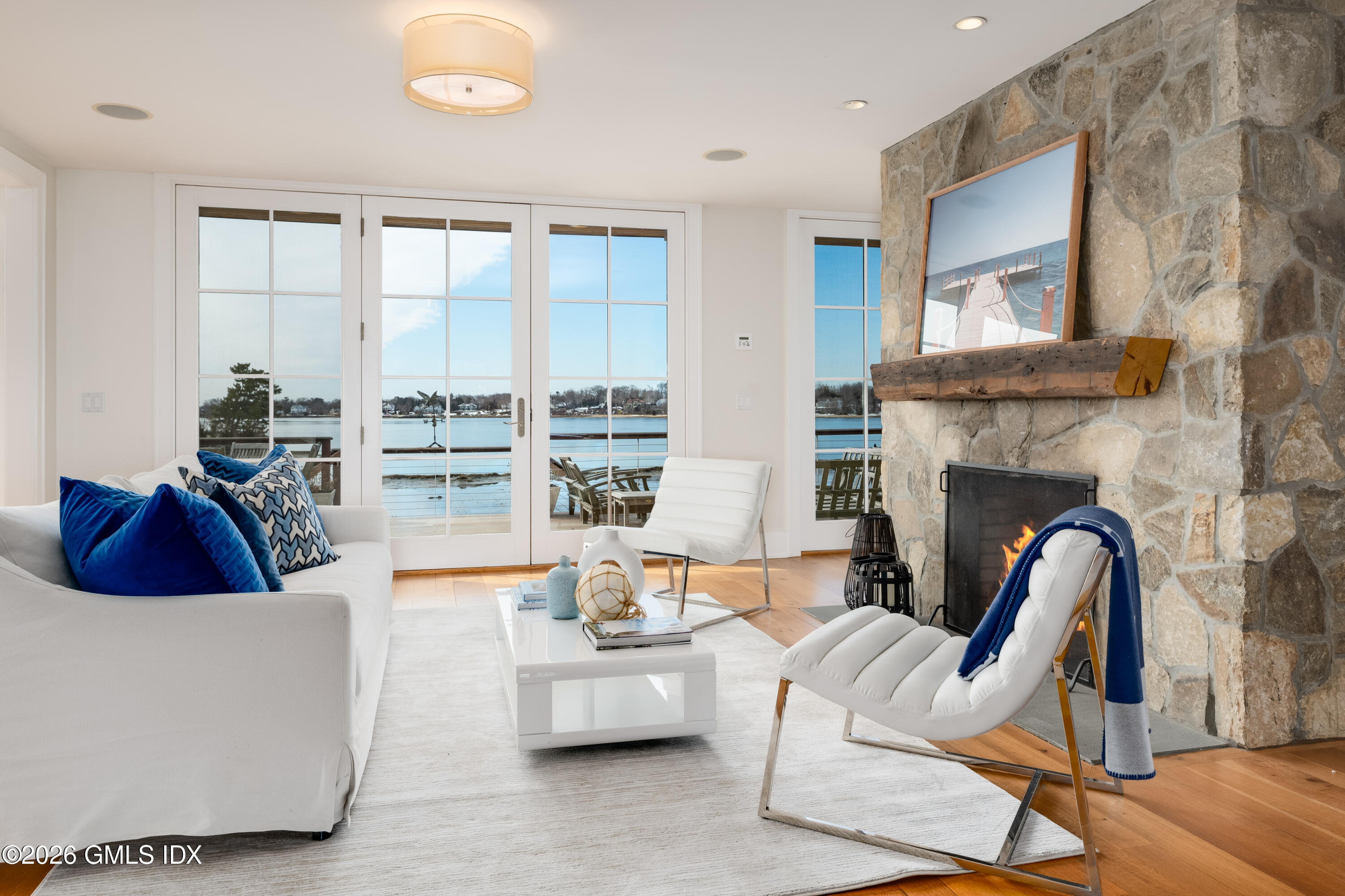 189 Shore Road Old Greenwich, CT 06870 - Photo 5 of 38 a living room with furniture and a fireplace
