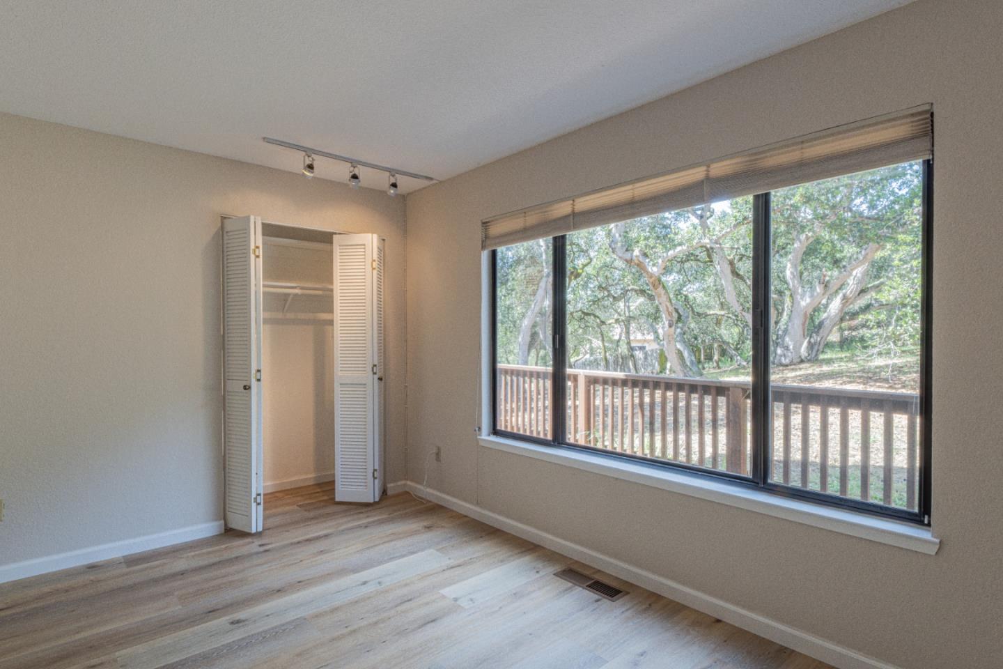 6959 Valle Pacifico Road Salinas, CA 93907 - Photo 26 of 45 a view of a room with wooden floor and windows