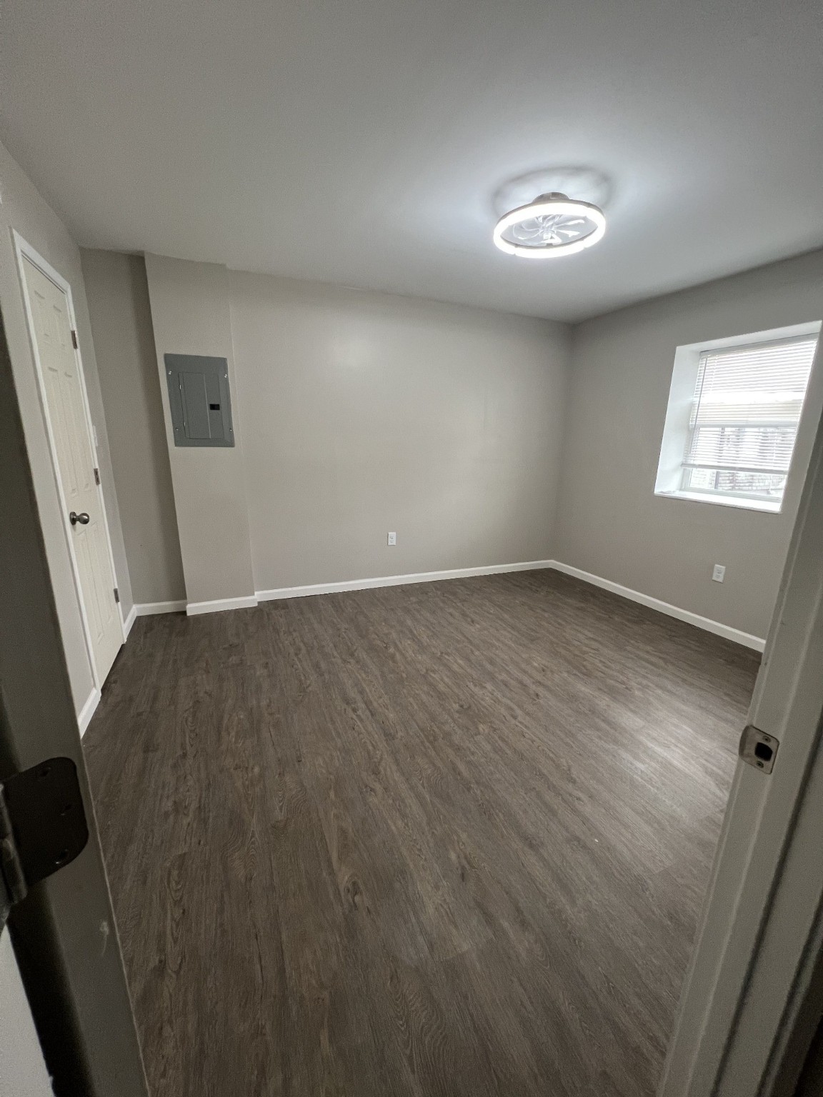 9745 Long Point Road, Unit 27 Houston, TX 77055 - Photo 17 of 17 an empty room with wooden floor and windows