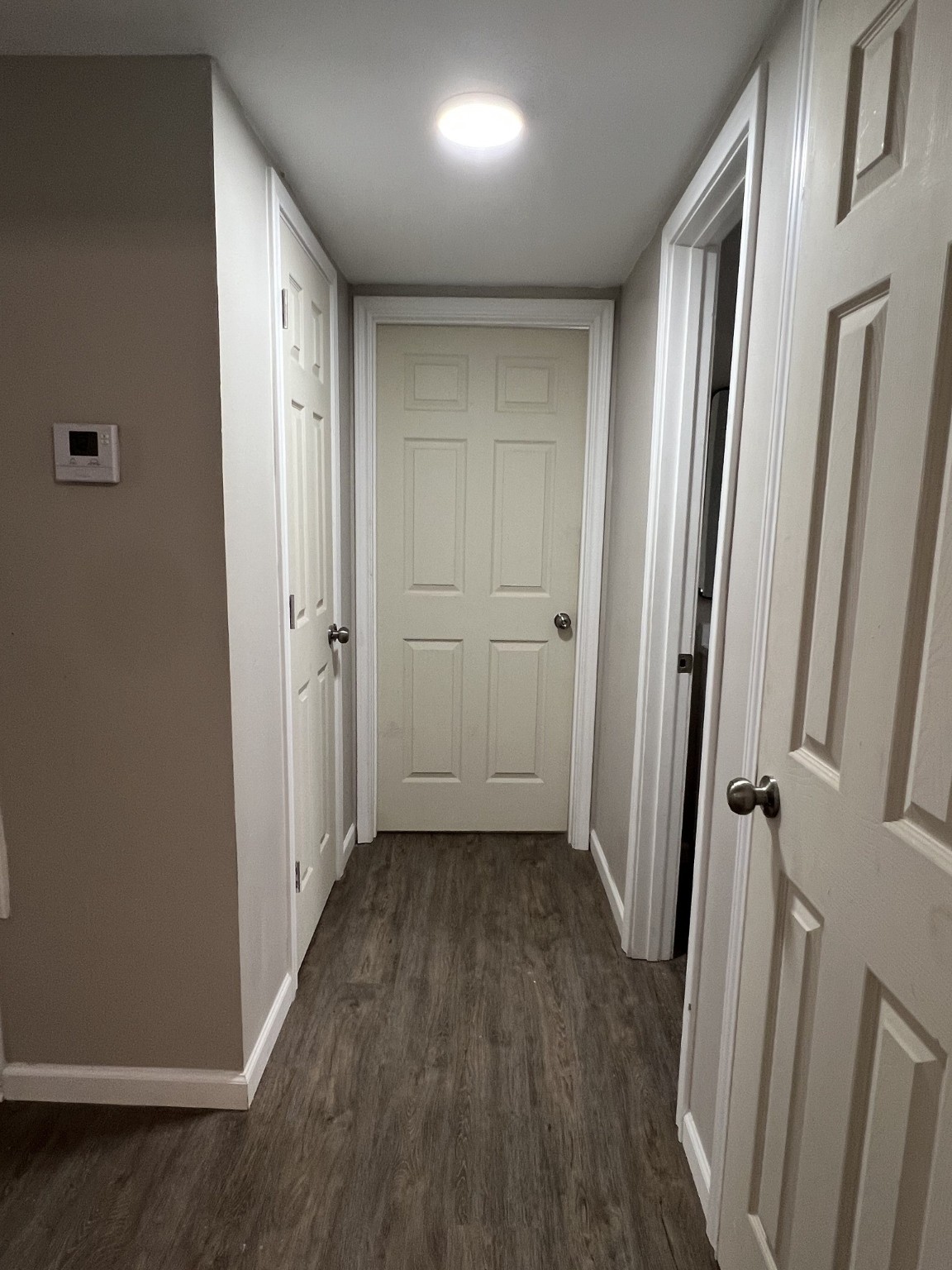 9745 Long Point Road, Unit 27 Houston, TX 77055 - Photo 10 of 17 a view of a hallway with wooden floor and a bathroom