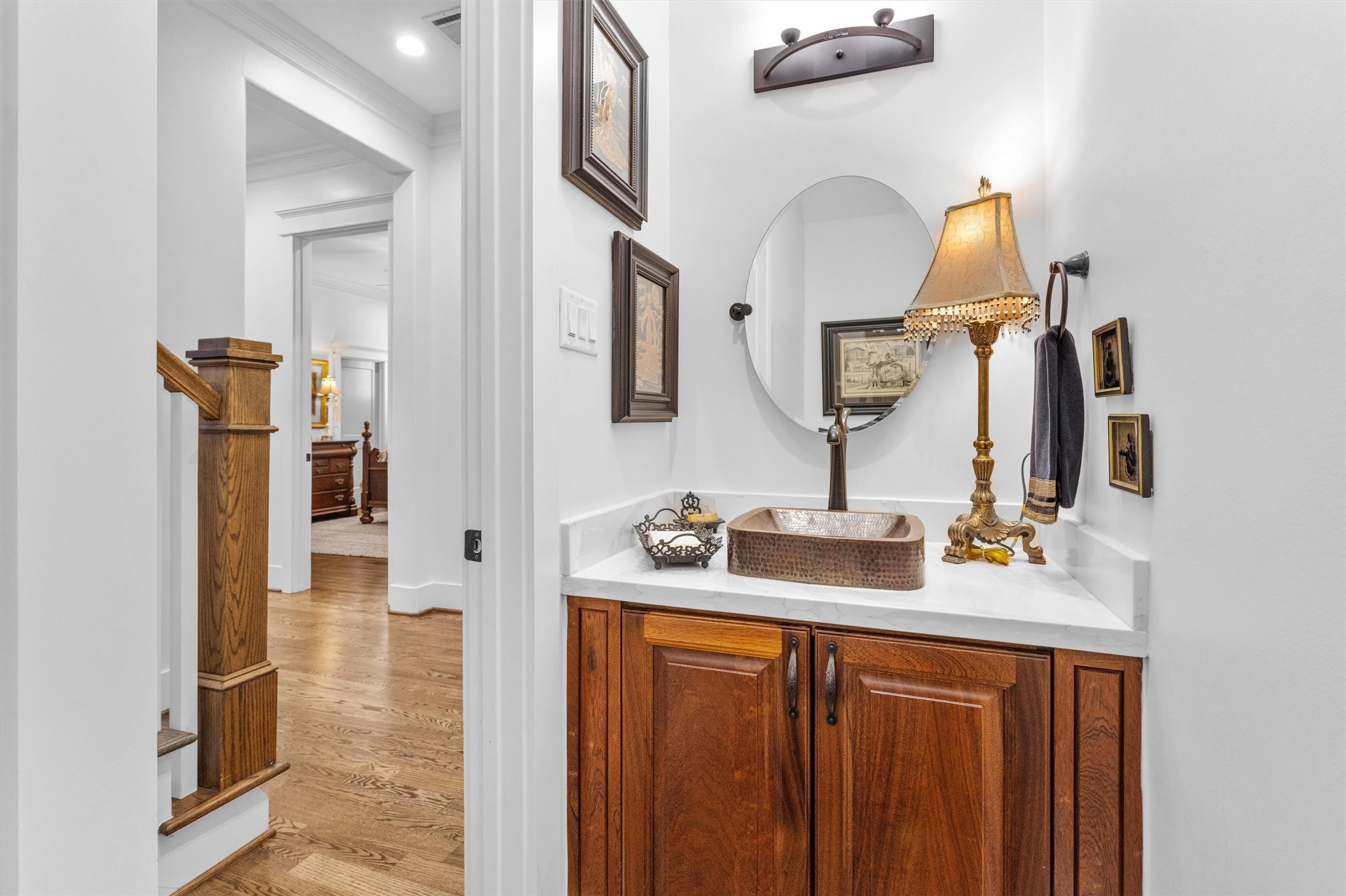 1202 Walton Street Houston, TX 77009 - Photo 18 of 32 Elegant Powder Room Featuring Timeless Finishes and Convenient Access for Family and Guests