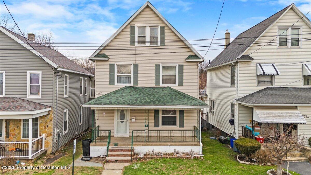 1441 Sanderson Avenue Scranton, PA 18509 - Photo 1 of 33 a front view of a house with a yard
