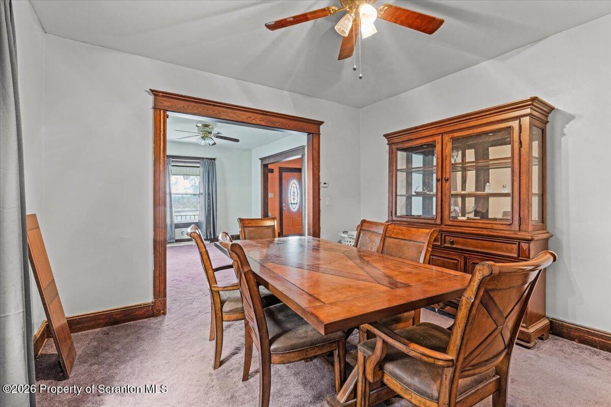 1441 Sanderson Avenue Scranton, PA 18509 - Photo 11 of 33 a view of a dining room with furniture and a chandelier