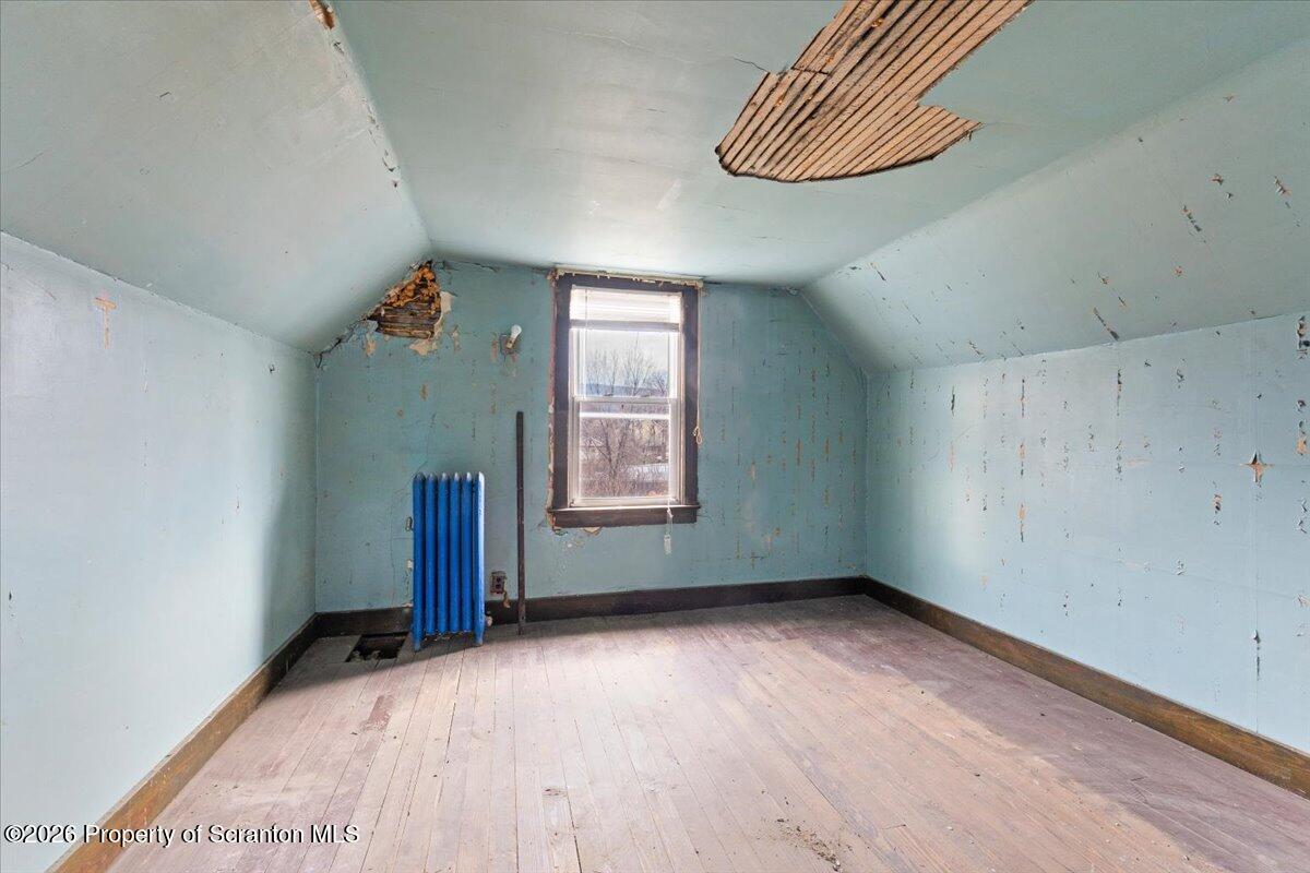 1441 Sanderson Avenue Scranton, PA 18509 - Photo 21 of 33 an empty room with a window and a ceiling fan