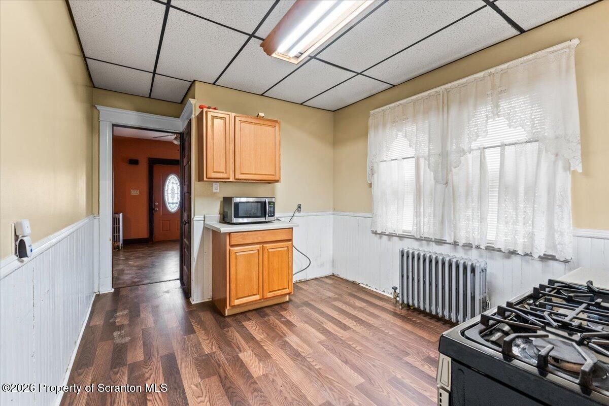 1441 Sanderson Avenue Scranton, PA 18509 - Photo 4 of 33 a kitchen with wooden floors and a stove